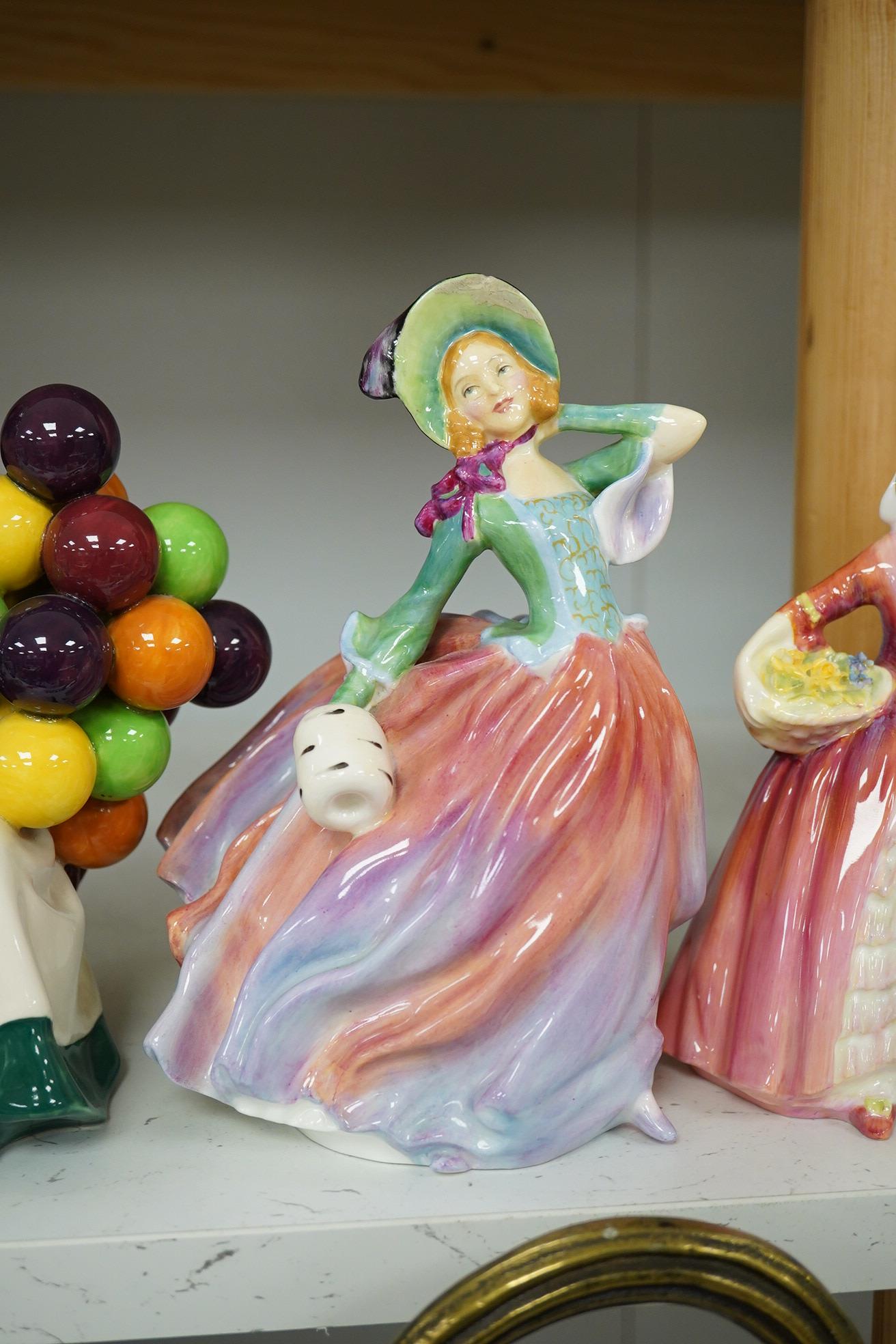 Four Royal Doulton figures to include The Ace HN 3398, Autumn Breezes HN 1911, Janet HN 1537 and The Old Balloon Seller HN 1315. Condition - good